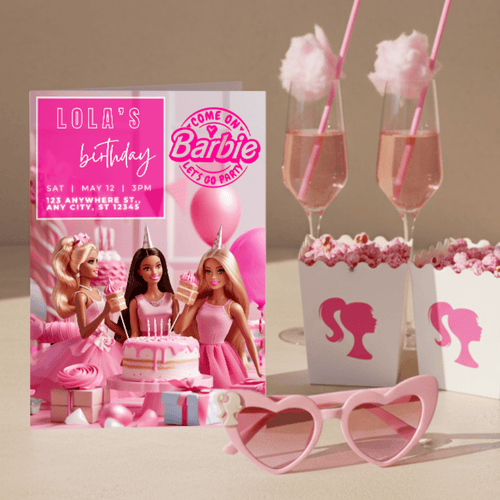 Barbie birthday invitation card on a party table with pink drinks and popcorn boxes, perfect Barbie theme birthday decor.