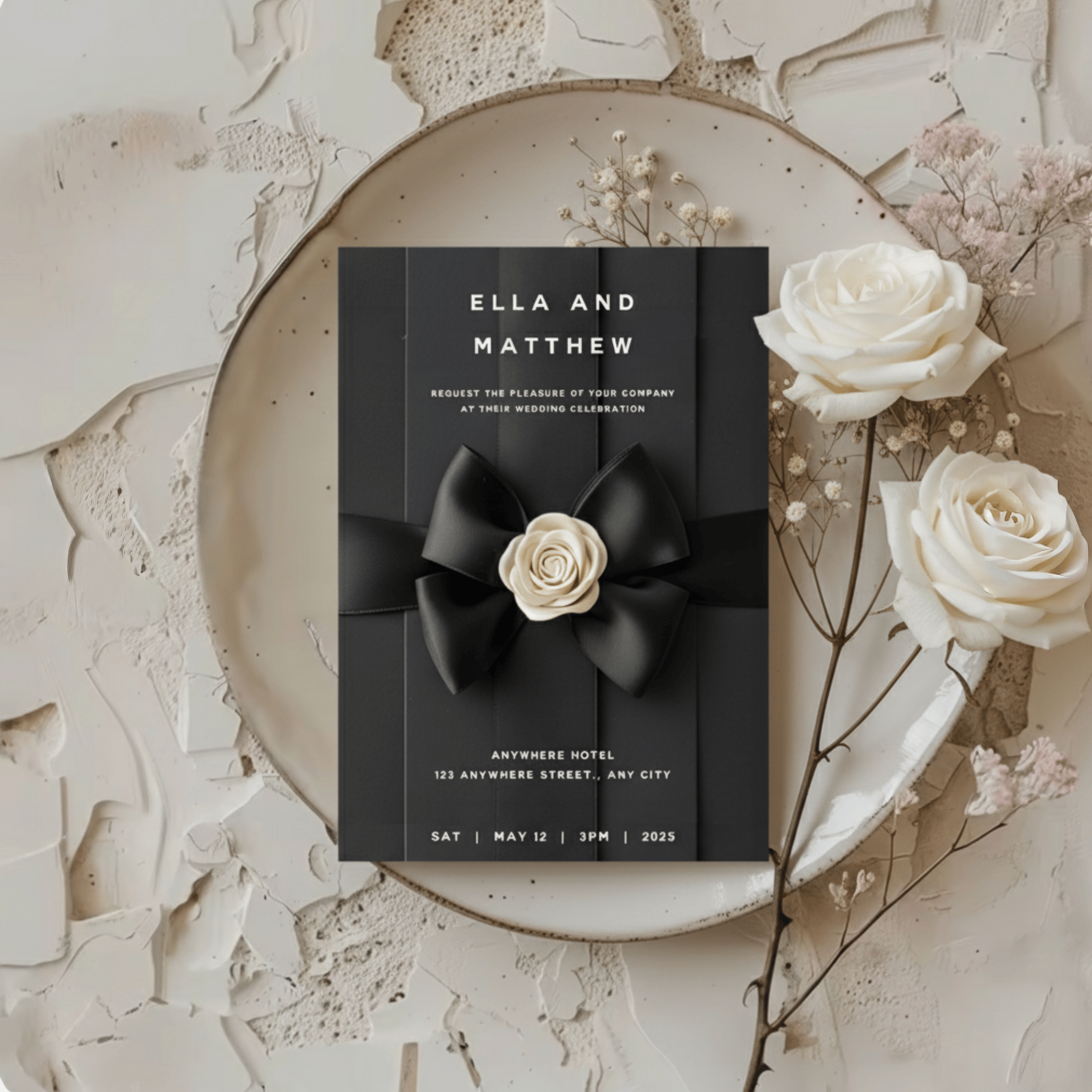 Chanel-inspired black and white wedding invitation with satin bow and ivory camellia flower on textured background minimalist luxury Canva template by Minimalist Print by Anaïs.