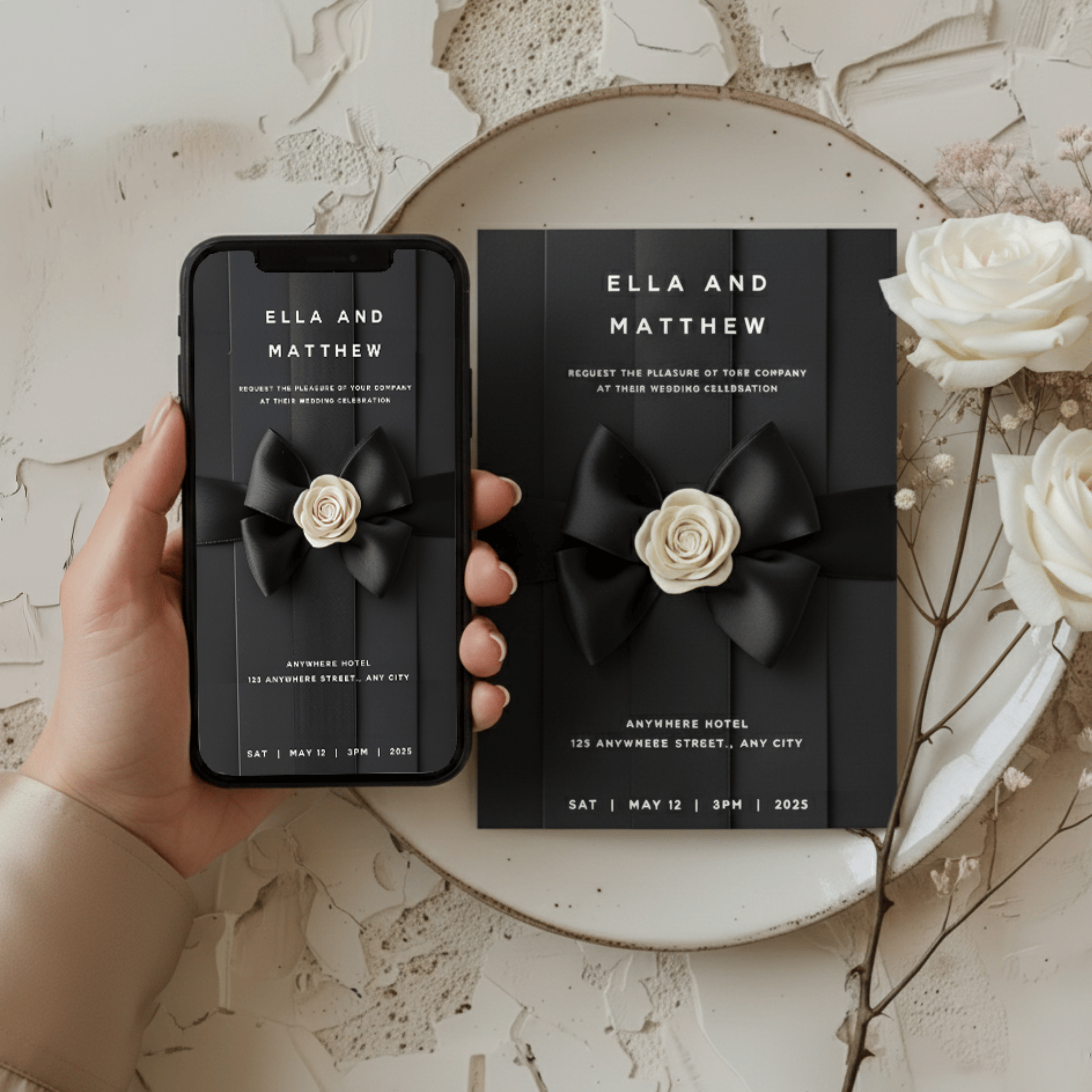 Flat-lay of Chanel-inspired wedding invitation with black satin bow and white camellia luxury monochrome stationery template.